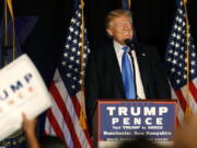 Republican presidential candidate Donald Trump smiles while speaking at a campaign rally in Manchester, N.H., on Thursday.