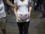 Kendra Wright, of Auburn listens to Republican presidential candidate Donald Trump speak during a campaign rally at Xfinity Arena of Everett, Tuesday, Aug. 30, 2016, in Everett, Wash.