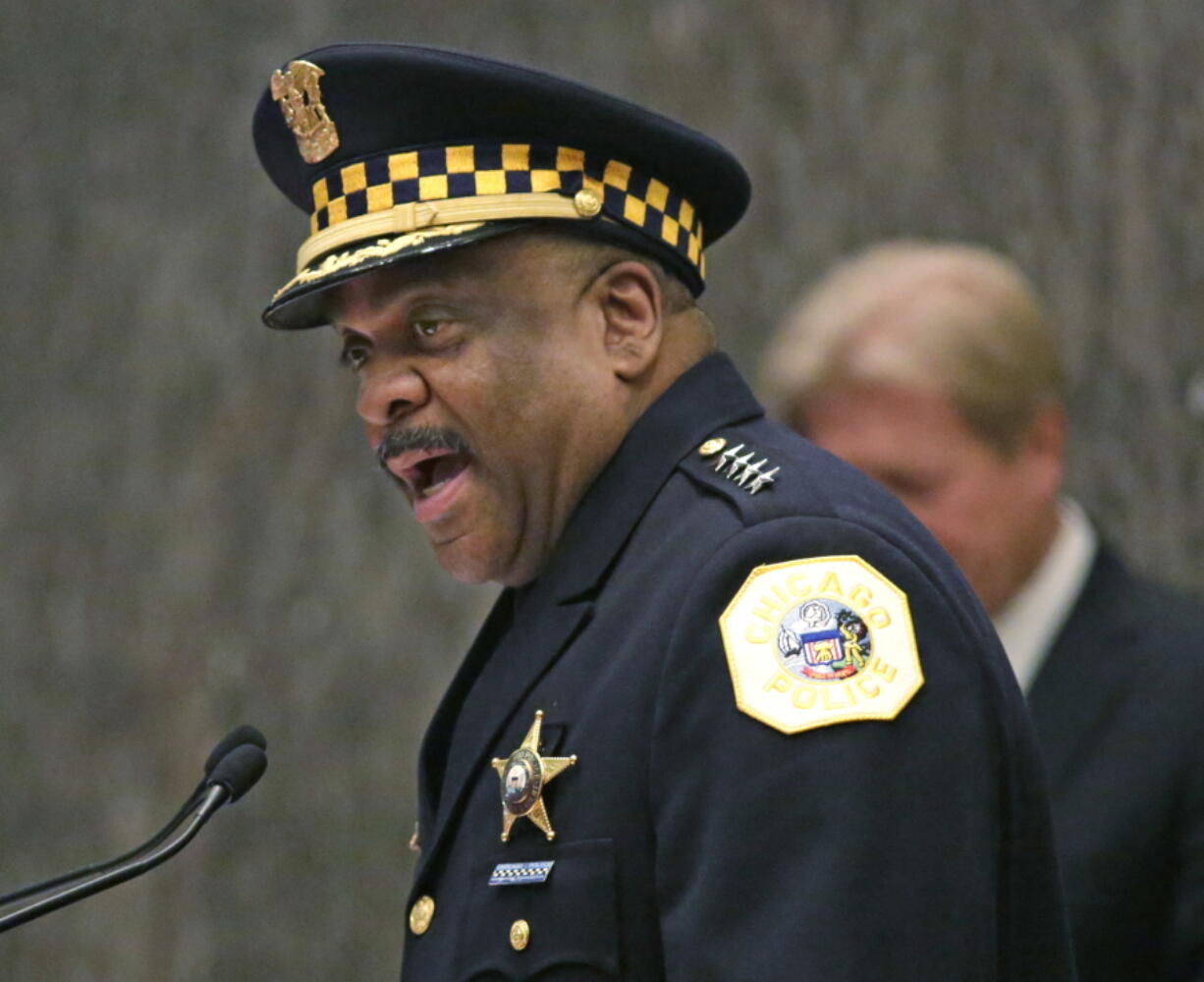 Eddie Johnson, left, speaks after being sworn in as the new Chicago police superintendent in Chicago. Superintendent Johnson says he will recommend the firing of seven officers involved in the Oct. 20, 2014 shooting death of black teenager Laquan McDonald. Superintendent Eddie Johnson said Thursday Aug. 18, 2016 he was accepting the recommendations of the city&#039;s inspector general who concluded that the officers filed false police reports. (AP Photo/M.