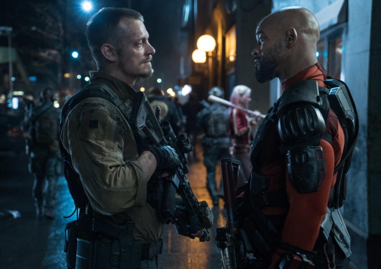 Joel Kinnaman, left, and Will Smith star in &quot;Suicide Squad,&quot; in theaters now. (Clay Enos/Warner Bros.