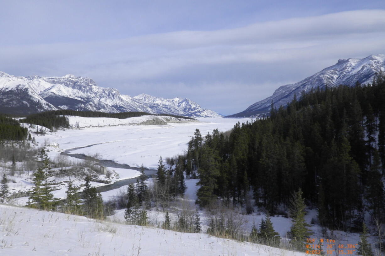 Researcher Mikkel Winther Pedersen shows a southward view down Cline River in Alberta, Canada, where retreating ice sheets created an ice-free corridor more than 13,000 years ago in February 2012. This is part of the ice-free corridor which was ruled out for migration by the first people to colonize the Americas, since no evidence of plants or animals were found along this route until about 12,600 years ago. Studies suggest that people had reached South America by at least 14,700 years ago. So in recent years, many scientists have concluded that the first southward migrants traveled along the Pacific coast instead, either in boats or on land.