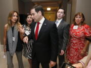 Sen. Marco Rubio, R-Fla., center, chats with attendees as he prepares to speak at the Republican Party of Palm Beach County&#039;s 15th annual Lobsterfest in Boca Raton, Fla.