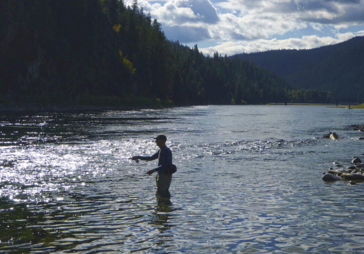 A fly fisherman casts on the Kootenai River in 2014 near the Montana-Idaho border and Leonia, Idaho. Idaho wants to take over regulating pollution discharge into the state&#039;s lakes and rivers from the federal government.