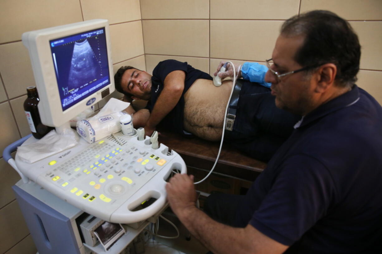 Sajjad Ghanbari undergoes a medical exam as part of the process of selling his kidney, in a clinic in downtown Tehran, Iran. In Iran, a unique system allows those in need of a transplant to buy a kidney.