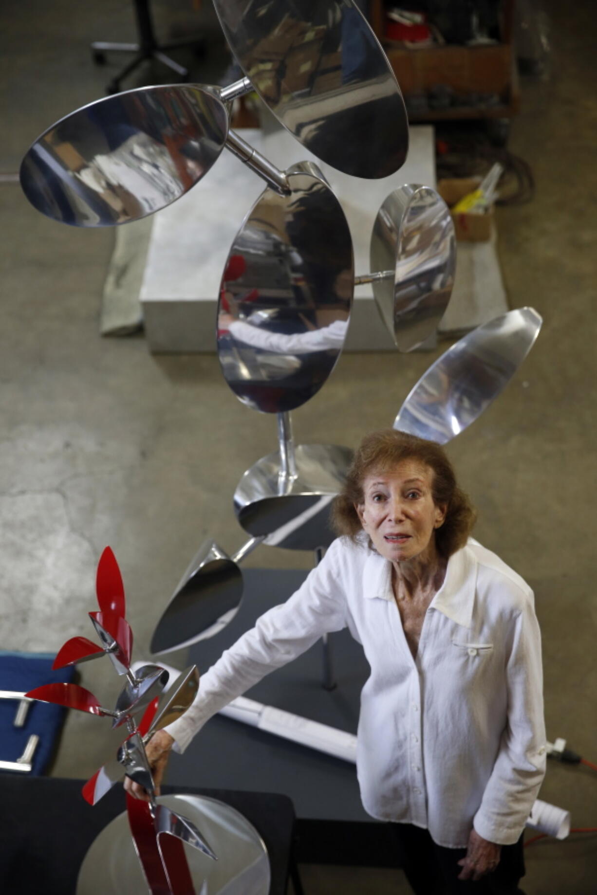 Sculptor Lin Emery poses in her studio in New Orleans, Tuesday, June 28, 2016. Her kinetic sculptures, moved by magnets, water, or wind, are in museum and private collections around the U.S., in Europe and the Far East.