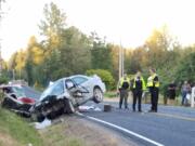 Deputies from the Clark County Sheriff's Department investigate a head-on crash in the 4400 block of Northeast 259th Street on Saturday.