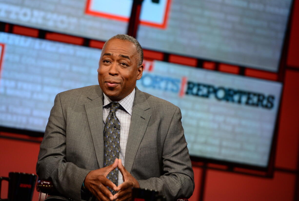 John Saunders poses on the set of &quot;The Sports Reporters&quot; in Studio A in Bristol, Conn. Saunders, who has hosted &quot;The Sports Reporters&quot; for the last 15 years, has died, the ESPN announced Wednesday. He was 61.