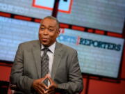 John Saunders poses on the set of &quot;The Sports Reporters&quot; in Studio A in Bristol, Conn. Saunders, who has hosted &quot;The Sports Reporters&quot; for the last 15 years, has died, the ESPN announced Wednesday. He was 61.