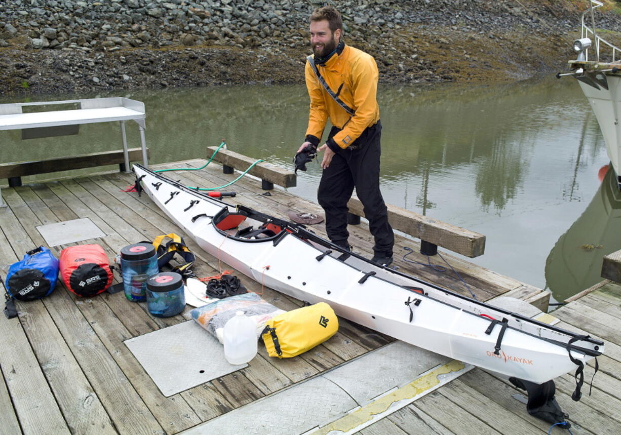 ADVANCE FOR RELEASE SATURDAY, AUG. 6, 2016 AND THEREAFTER In this July 25, 2016 photo, Austin Jones unpacks his foldable kayak in Juneau, Alaska, after finishing a trip from Anacortes, Washington, to Juneau. Jones&#039; &quot;origami kayak,&quot; as the manufacturer&#039;s website puts it, looks like it&#039;s made out of corrugated cardboard, something more suited to campaign signs than open seas.