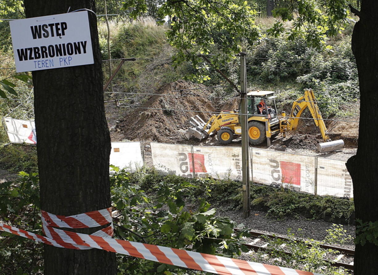 Heavy machinery begins the search, the work of explorers hoping to find a legendary Nazi train laden with treasure and armaments in Walbrzych, Poland, on Tuesday. The search attests to the power of a local legend claiming a Nazi &#039;gold&#039; train disappeared in a mountain tunnel as the Germans escaped the advancing Soviet army at the end of World War II. on the left side of the plagues, &quot;Trespassing&quot;.