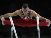 United States&#039; Sam Mikulak performs on the parallel bars during the artistic gymnastics men&#039;s team final at the 2016 Summer Olympics in Rio de Janeiro, Brazil, Monday, Aug. 8, 2016.