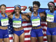 The United States team from left, Allyson Felix, English Gardner, Tianna Bartoletta and Tori Bowie celebrate winning the gold medal in the women&#039;s 4x100-meter relay final during the athletics competitions of the 2016 Summer Olympics at the Olympic stadium in Rio de Janeiro, Brazil, Friday, Aug. 19, 2016.