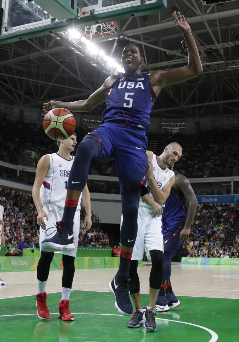 United States' Kevin Durant (5) reacts after dunking against Serbia during the men's gold medal basketball game at the 2016 Summer Olympics in Rio de Janeiro, Brazil, Sunday, Aug. 21, 2016.