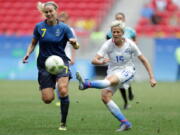 United States&#039; Megan Rapinoe kicks the ball past Sweden&#039;s Lisa Dahlkvist during a quarterfinal match of the women&#039;s Olympic football tournament Friday between the United States and Sweden in Brasilia. The U.S. lost after a penalty shoot-out.