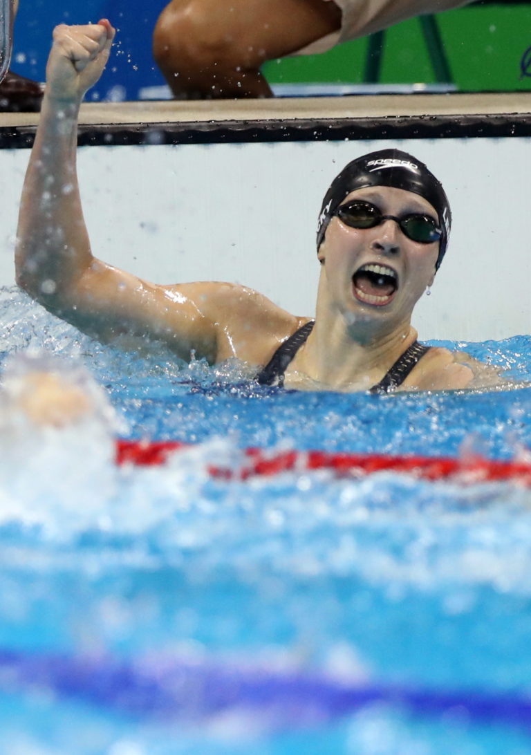 United States' Katie Ledecky celebrates winning the gold medal in the women's 400-meter freestyle setting a new world record during the swimming competitions at the 2016 Summer Olympics, Sunday, Aug. 7, 2016, in Rio de Janeiro, Brazil.