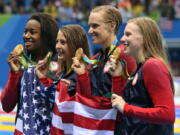 From right to left, United States&#039; Lilly King, Dana Vollmer, Kathleen Baker and Simone Manuel display their gold medals for the women&#039;s 4 x 100-meter medley relay final. The victory marked the 1,000th Olympic gold medal won by the United States since 1904.