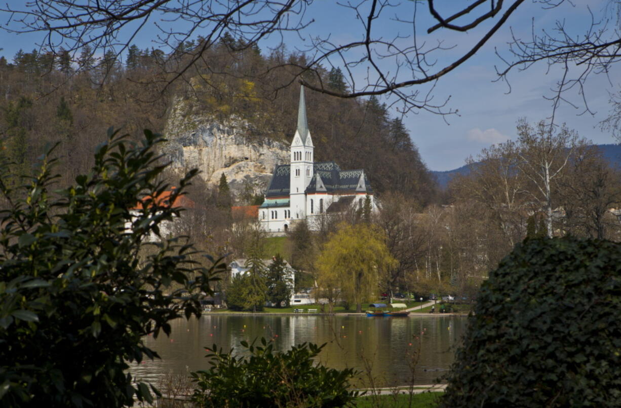 A church is seen on the shore of Lake Bled, northern Slovenia. It was at the lakeside Grand Hotel Toplice in Bled where Melanija Knavs, who later changed her name to Melania Knauss, introduced Donald Trump to her parents during their brief visit to Slovenia in July 2002, two years before they engaged. It is believed that it was the last time that the former model visited her native country.