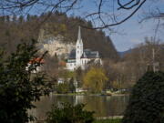 A church is seen on the shore of Lake Bled, northern Slovenia. It was at the lakeside Grand Hotel Toplice in Bled where Melanija Knavs, who later changed her name to Melania Knauss, introduced Donald Trump to her parents during their brief visit to Slovenia in July 2002, two years before they engaged. It is believed that it was the last time that the former model visited her native country.