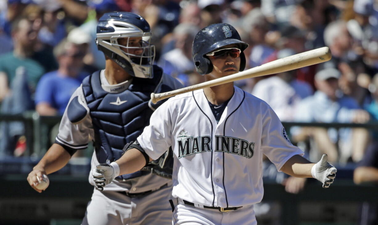 Seattle Mariners&#039; Norichika Aoki flips his bat after striking out as New York Yankees catcher Gary Sanchez throws back to the mound in the fifth inning of a baseball game Wednesday, Aug. 24, 2016, in Seattle.