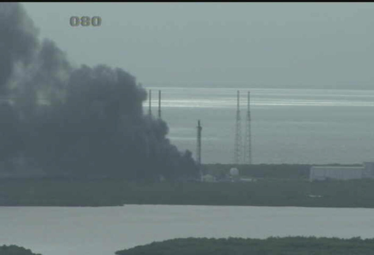 An image from a webcam at NASA&#039;S Kennedy Space Center shows an explosion Thursday at a SpaceX launch site.