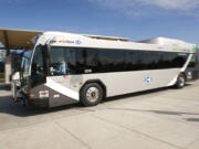 C-Tran was awarded a federal grant to purchase 10 new diesel-electric hybrid buses like this one dropping and picking up passengers in Hazel Dell.