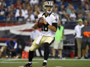 New Orleans Saints quarterback Garrett Grayson looks to pass against the New England Patriots during the first half of a preseason NFL football game Thursday, Aug. 11, 2016, in Foxborough, Mass.