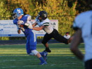 La Center&#039;s Jackson Leslie eludes Woodland&#039;s Jacob Davis at a game against Woodland in La Center.