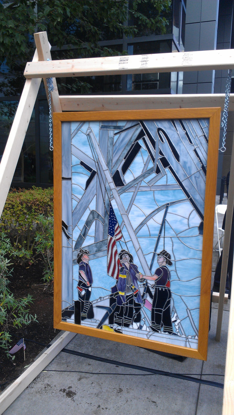 Woodland resident Gerald Siegel donated his stained glass art depicting New York Firefighters raising the American flag at Ground Zero to the city of Vancouver. The piece was unveiled Sunday at a Patriot Day ceremony in Vancouver honoring victims of the 9/11 terrorist attacks.