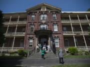 Members of the Class of 1966 gather for a photo in front of Providence Academy during their reunion on May 17.