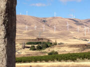 Visitors to the Stonehenge Memorial along Highway 14 have sweeping views of the Columbia River, the Gorge and the hills dotted with vineyards and wind turbines.