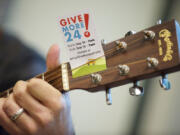 Pat Kearns of the band Blue Skies for Black Hearts plays a few songs for the staff at MacKay Sposito as part of 2014&#039;s Give More 24! charity event. This year&#039;s 24-hour event is scheduled for Thursday.