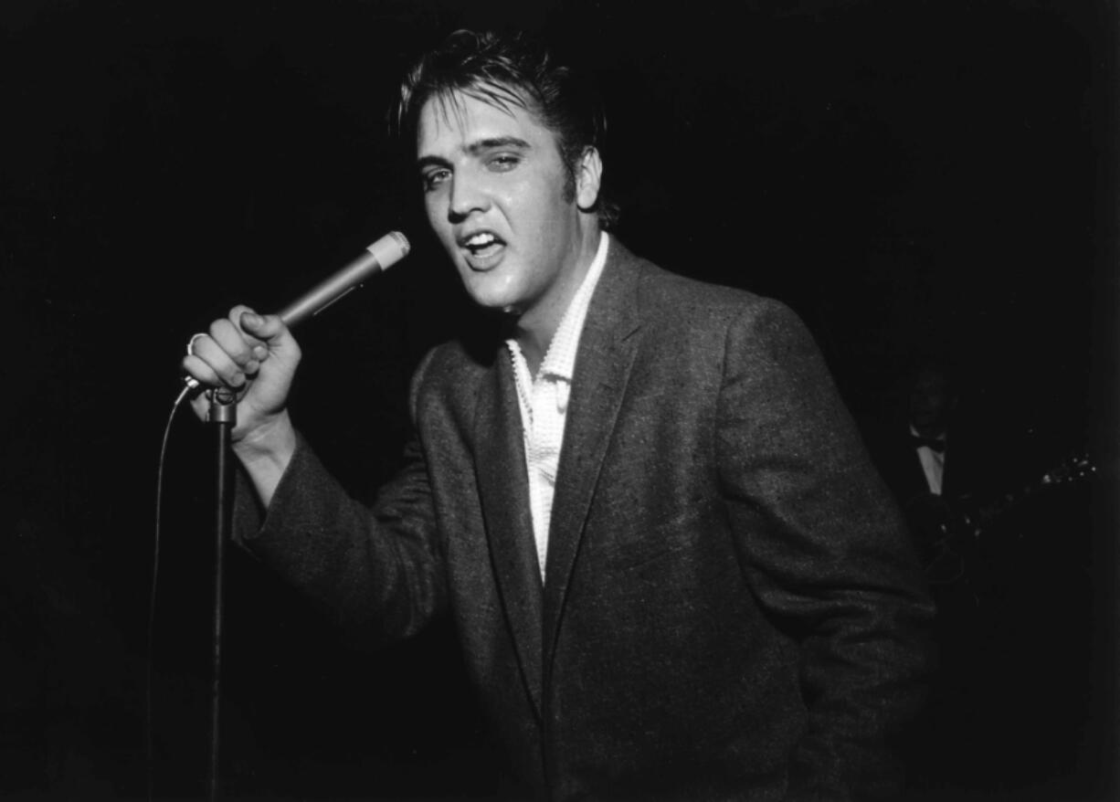 Elvis Presley performs in Bob Neal&#039;s Cotton Picking Jamboree for more than 7,000 people on May 15, 1956, at Ellis Auditorium in Memphis, Tenn.