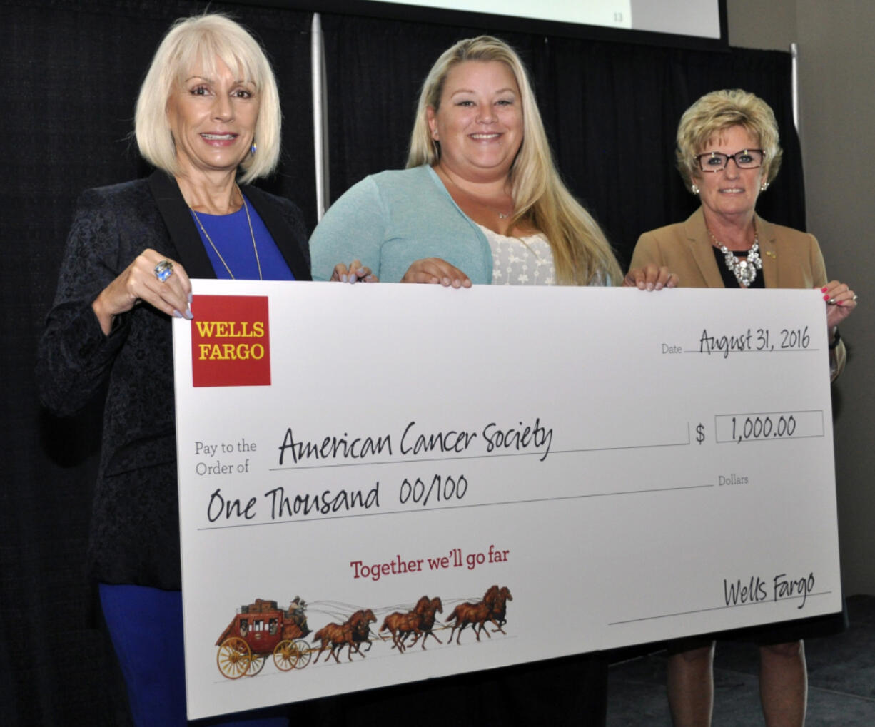 Mt. Vista: Wells Fargo Volunteer Service Award winner Janeen Brooks, center, earned a $1,000 grant for the American Cancer Society through her volunteer work with the organization.