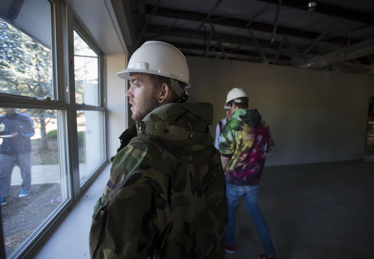 Daybreak Youth Services resident Anthony Yandell, 17, looks out the window while touring the new facility under construction in Brush Prairie on Wednesday morning, Sept. 14, 2016.