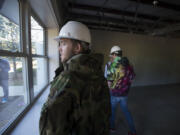 Daybreak Youth Services resident Anthony Yandell, 17, looks out the window while touring the new facility under construction in Brush Prairie on Wednesday morning, Sept. 14, 2016.