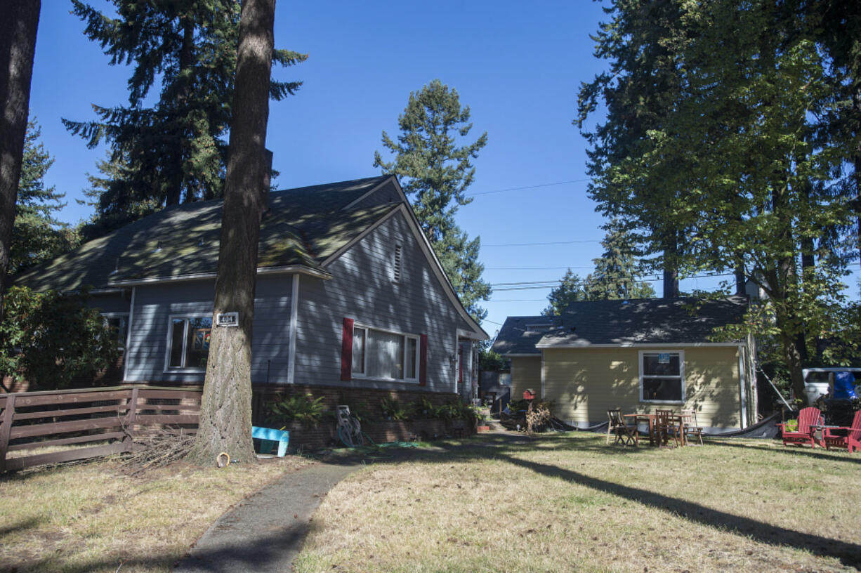 An accessory dwelling unit under construction, right, is seen next to a house along Daniels Street on Sept.