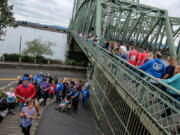 Participants in the 15th annual Hands Across the Bridge sobriety event walked from Esther Short Park in downtown Vancouver up to the Interstate 5 Bridge on Monday.