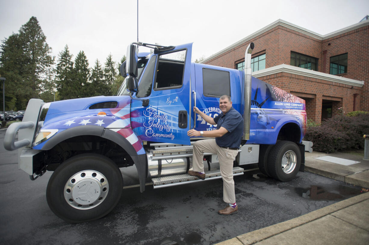 Steve Hull of Allen Lund Company with Big Al outside his northeast Vancouver office.