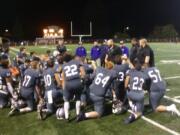 Heritage coach Matt Gracey talks to his players after the Timberwolves 21-12 win over Prairie.