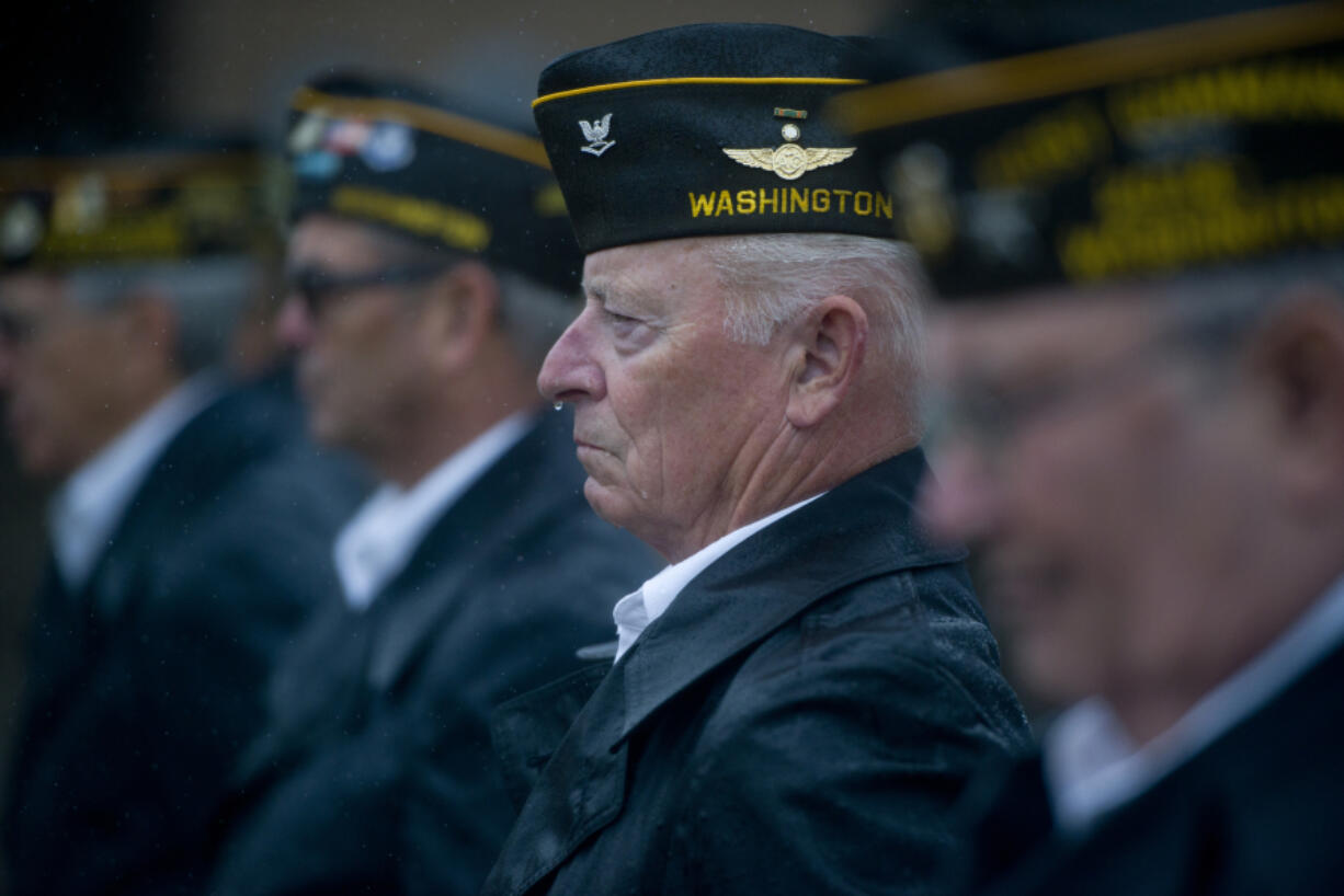 Jim McHenry of VFW Post 7824 observes National POW/MIA Recognition Day Observance in the rain Saturday at the Armed Forces Reserve Center in Vancouver.