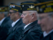 Jim McHenry of VFW Post 7824 observes National POW/MIA Recognition Day Observance in the rain Saturday at the Armed Forces Reserve Center in Vancouver.