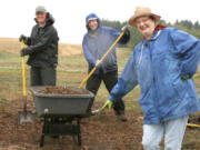 Salmon Creek: About two dozen Salmon Creek United Methodist Church members, including, Bob Cooke, left, and Roger Anderson, joined Pastor Joyce Emery in a &quot;blessing blitz&quot; to haul wood chips for weed control at the 78th Street Heritage Farm.