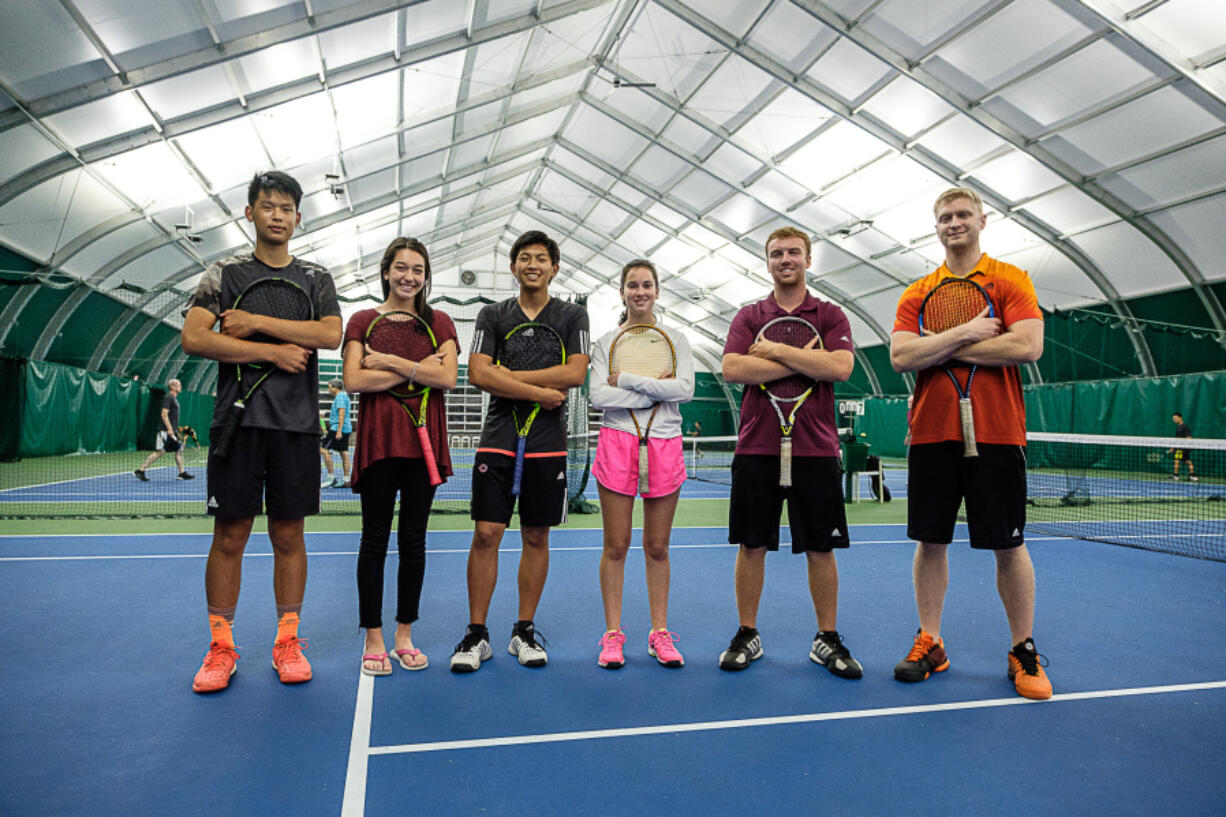 Pictured from left, Wilson Ho, Samantha Merrill, Brian Wang, Grace Maxey, Bjorn Morfin, and coach Matt Houser, at the Evergeen Tennis Center in Camas.