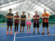 Pictured from left, Wilson Ho, Samantha Merrill, Brian Wang, Grace Maxey, Bjorn Morfin, and coach Matt Houser, at the Evergeen Tennis Center in Camas.