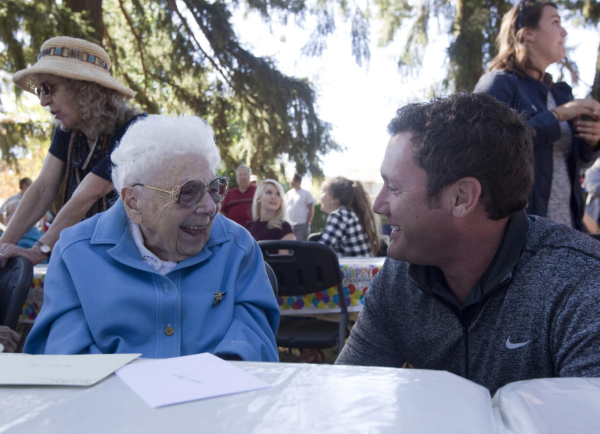 Vancouver Mayor Tim Leavitt congratulates Hazel Stein on her 100th birthday Saturday in Vancouver. Stein donated property to be converted into a neighborhood park.