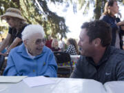 Vancouver Mayor Tim Leavitt congratulates Hazel Stein on her 100th birthday Saturday in Vancouver. Stein donated property to be converted into a neighborhood park.