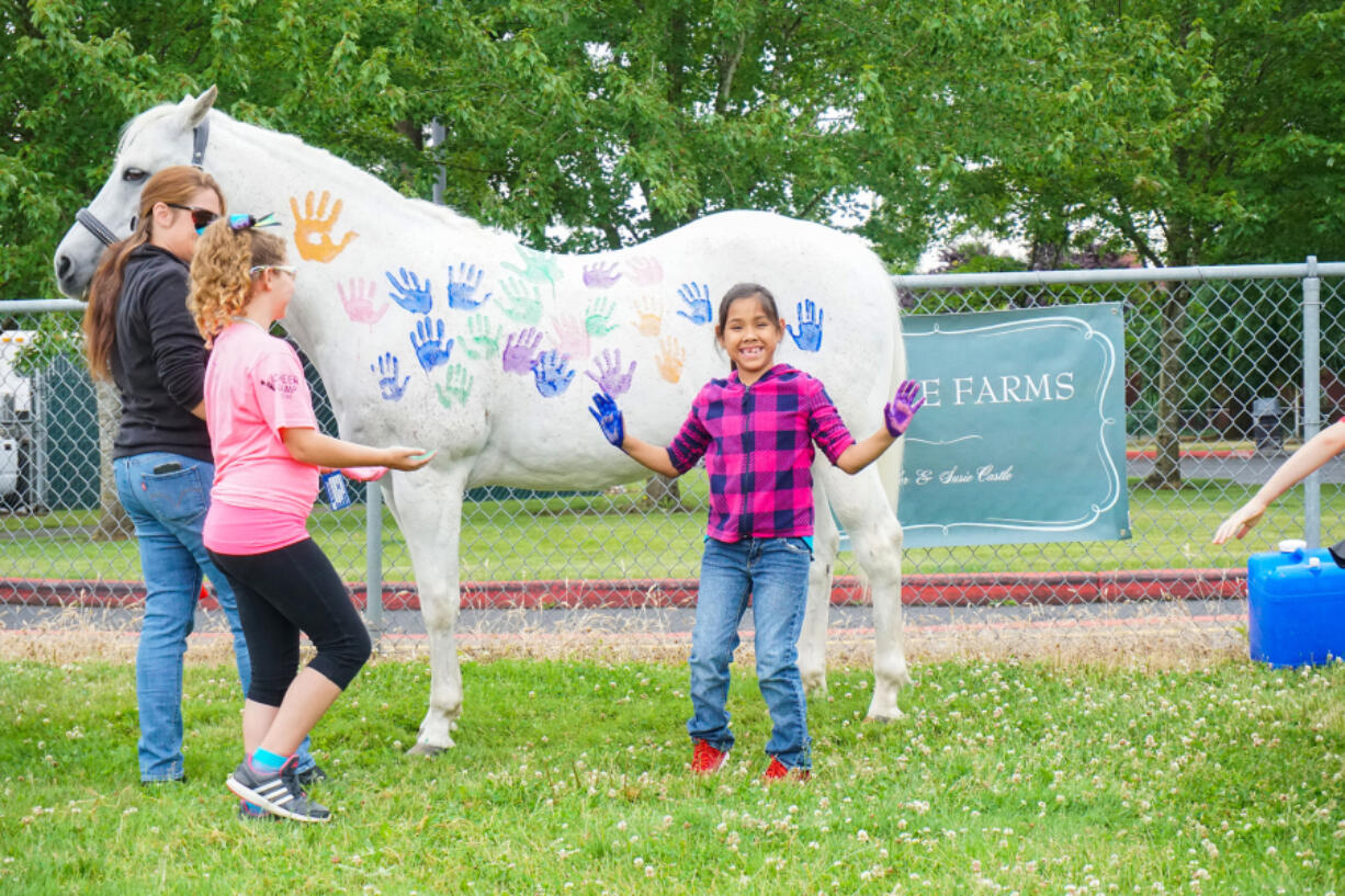 East Vancouver: Students from Evergreen Public Schools meet with Peppa the therapy horse at a Police Activities League summer camp.