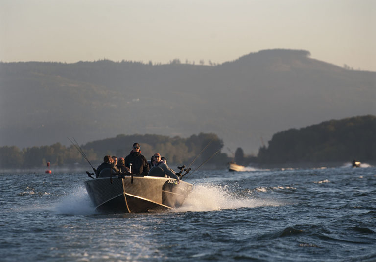 Forest Shields of Gone Catchin' Guide Service, standing, leads a group of participants Monday morning, Sept. 12, 2016 along the Columbia River.