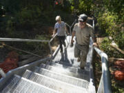 Margaret and Art Rojsza of Artus Construction walk up the completed stairs they built at Wintler Park&#039;s east entrance.