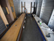 James O&#039;Brien plays shuffleboard in a storage unit he rented before moving into a shop in east Vancouver. Through their business, O&#039;Brien and his wife, Sara O&#039;Brien, plan to supply and service local tables while reinvigorating the local shuffleboard scene.